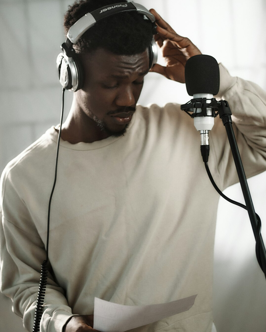 man practicing voice exercises