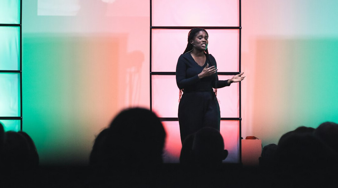 woman giving speech to audience