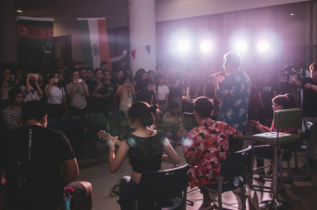 leader on stage with audience