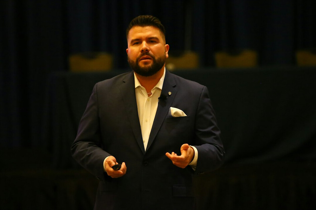 executive speaking confidently on stage