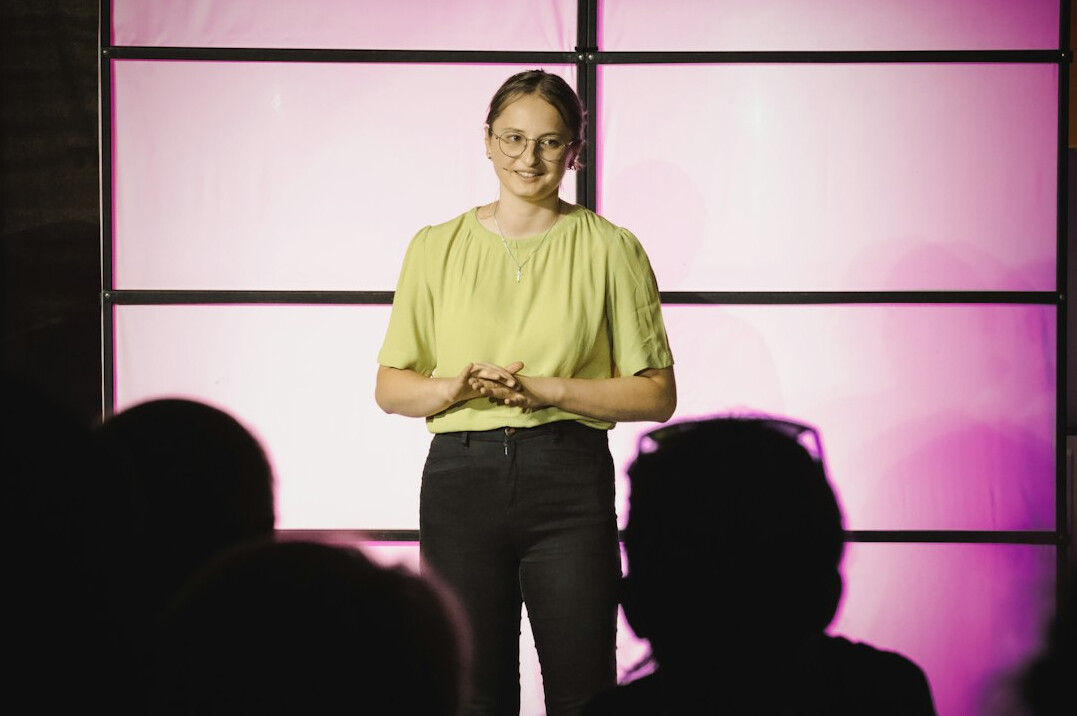 woman presenting to audience