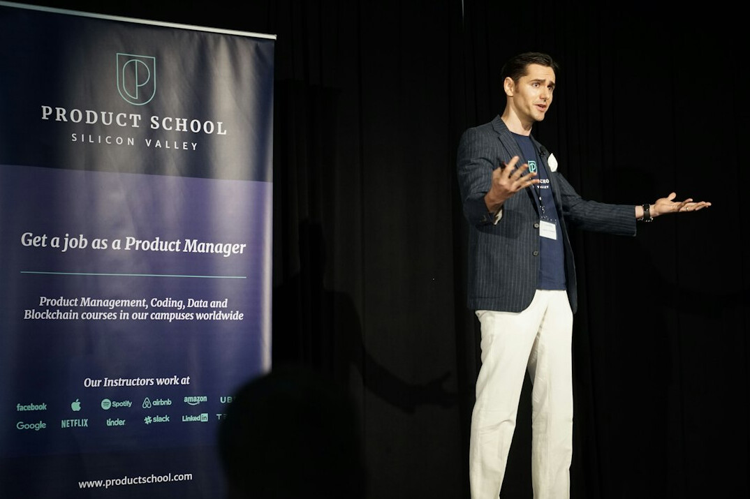 man speaking on stage