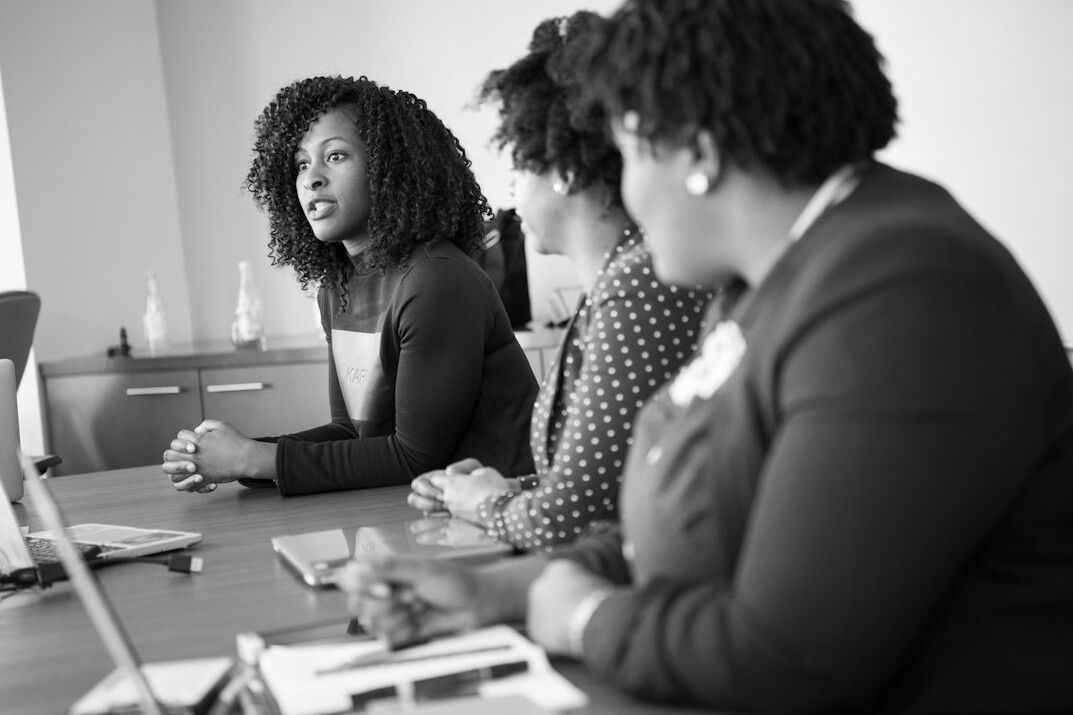 woman leading meeting with presence