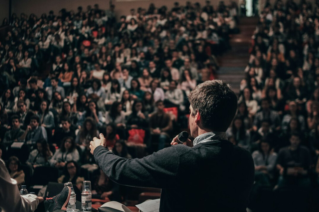 business leader presenting on stage