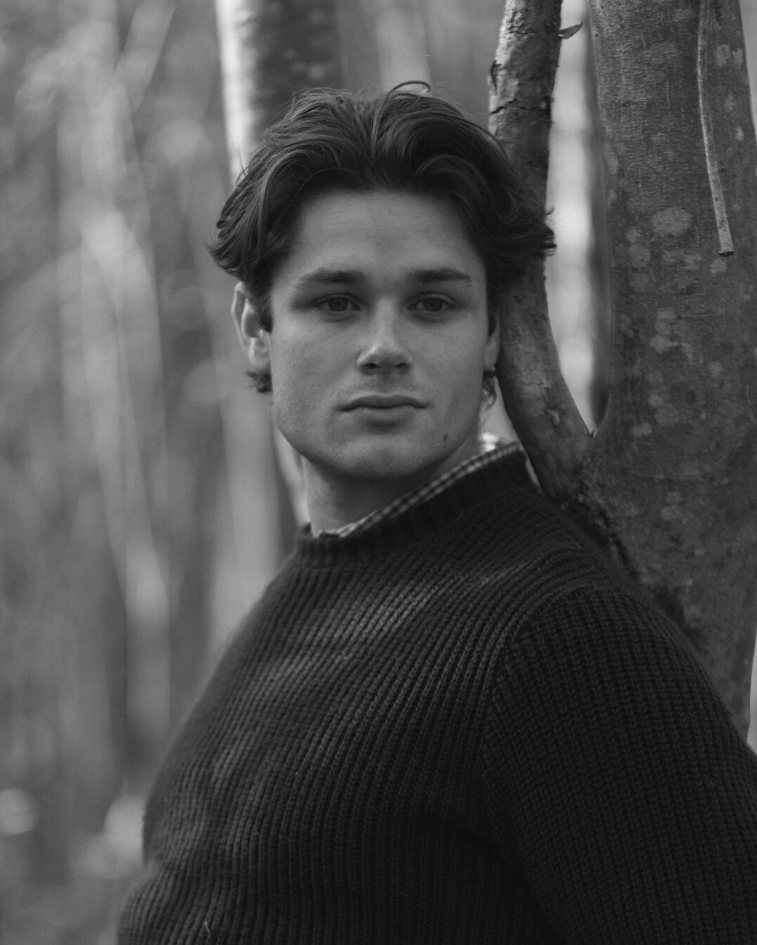 Portrait of a German man in his fifties with short grey hair in a dark sweater